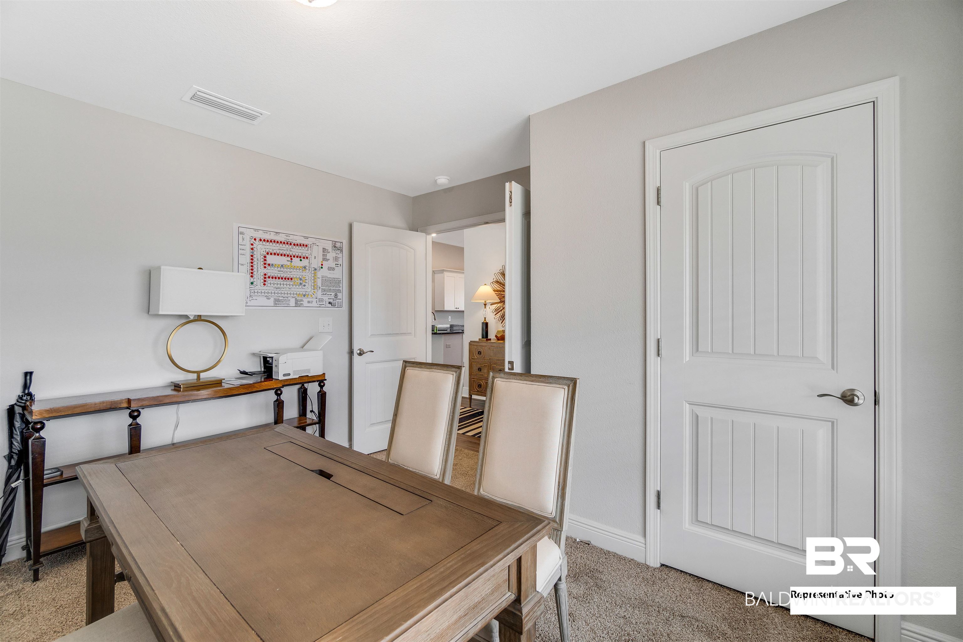 643 Mayflower Drive Foley, AL 36535 - Photo 4 of 34 Home office with light carpet, baseboards, and visible vents