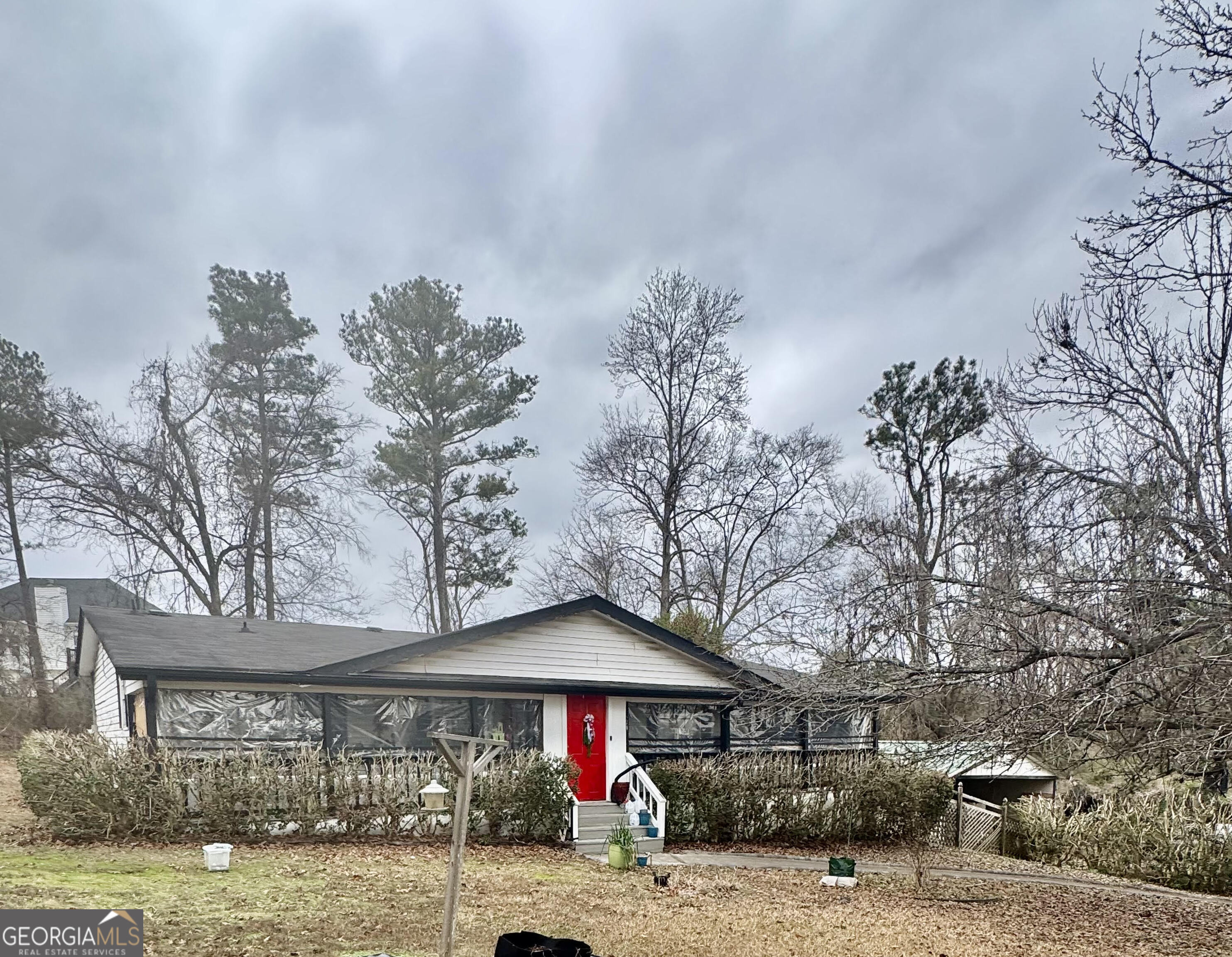 a front view of a house with garden