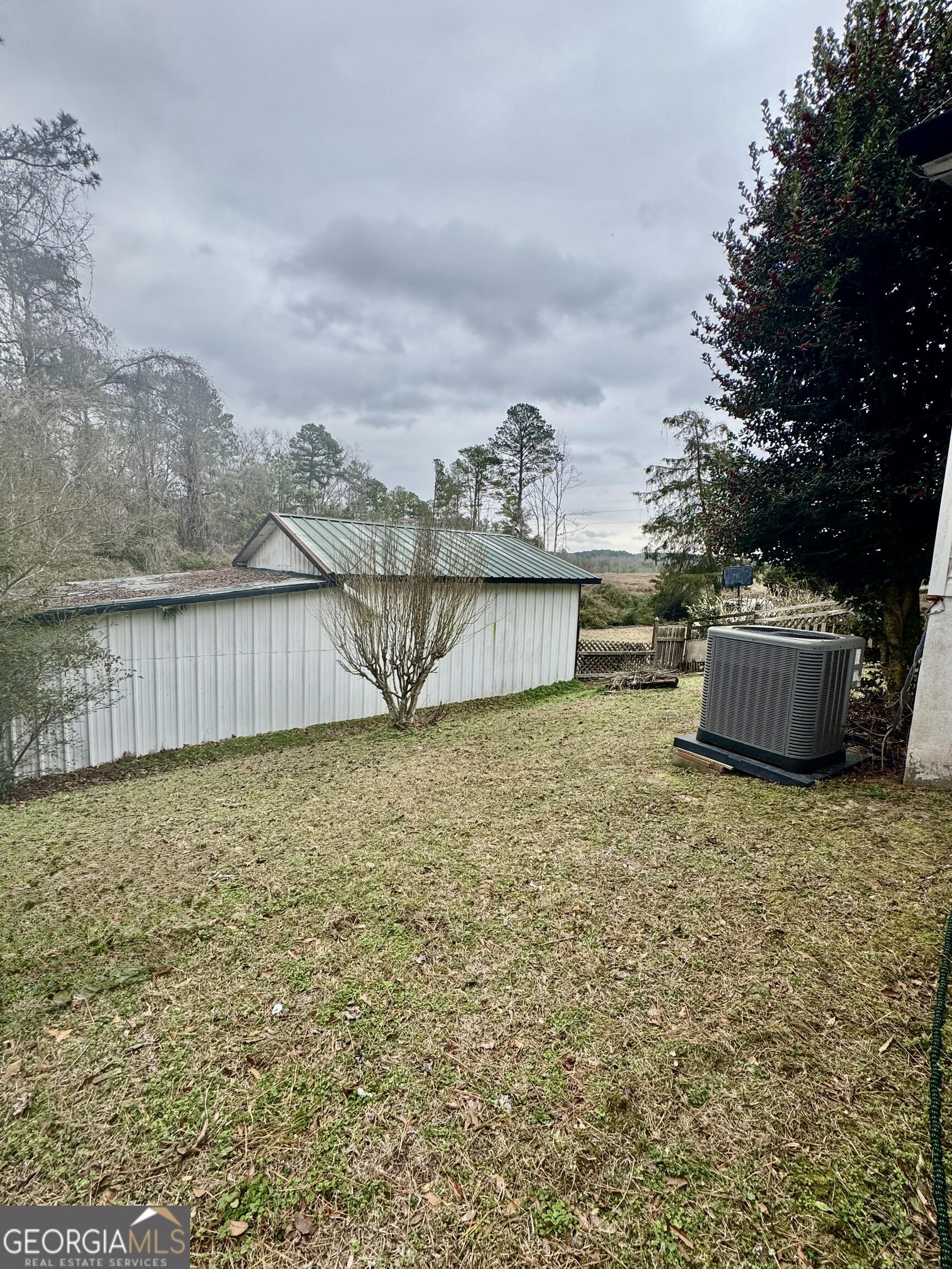 29 Settlement Road Dallas, GA 30132 - Photo 11 of 13 a view of a terrace with a garden