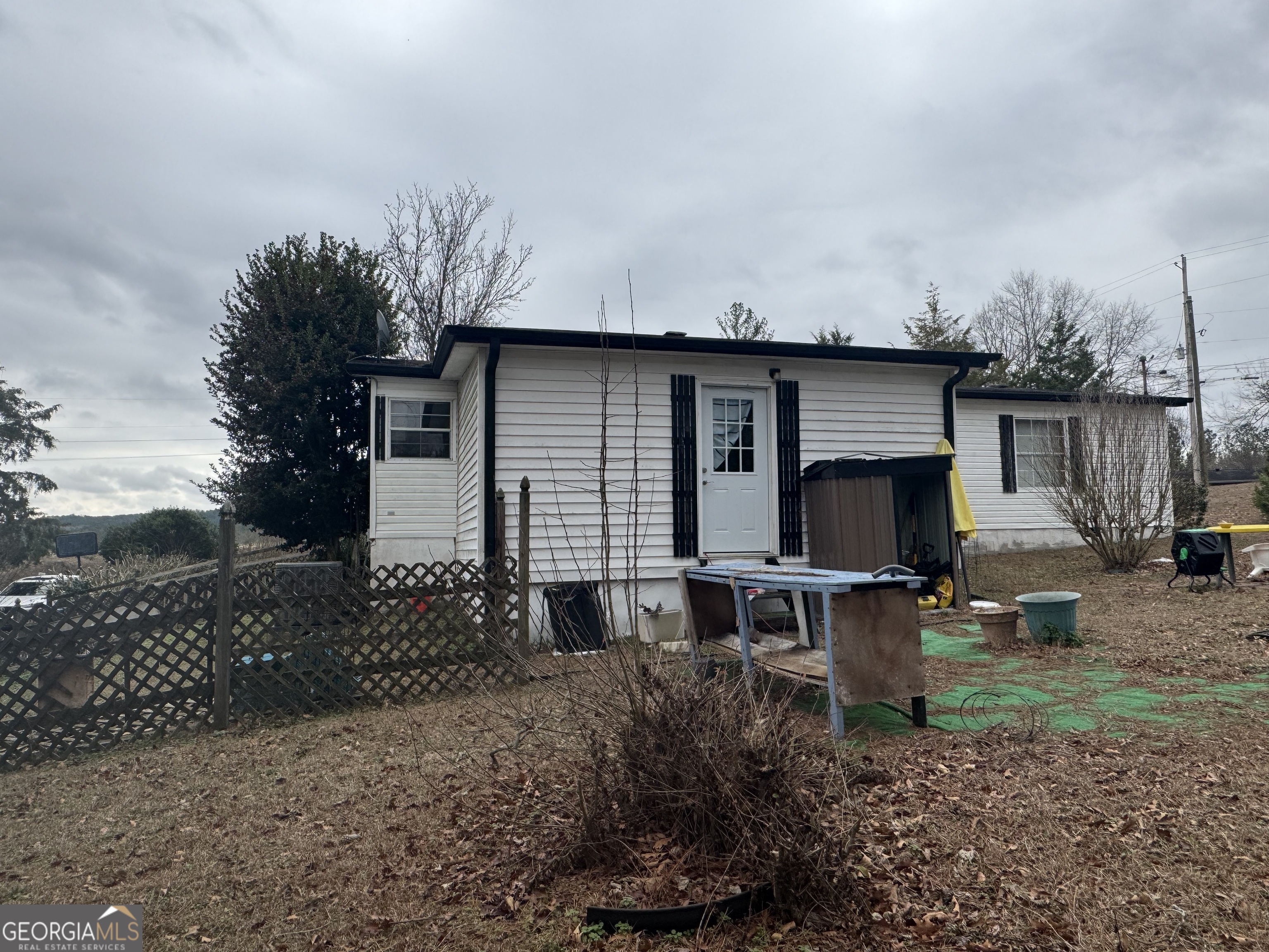 29 Settlement Road Dallas, GA 30132 - Photo 2 of 13 a view of a house with backyard and sitting area