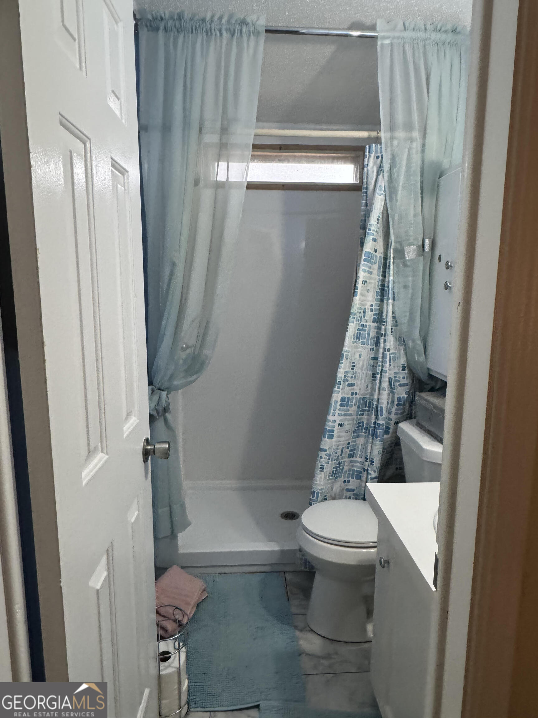 29 Settlement Road Dallas, GA 30132 - Photo 6 of 13 a bathroom with a toilet and a shower