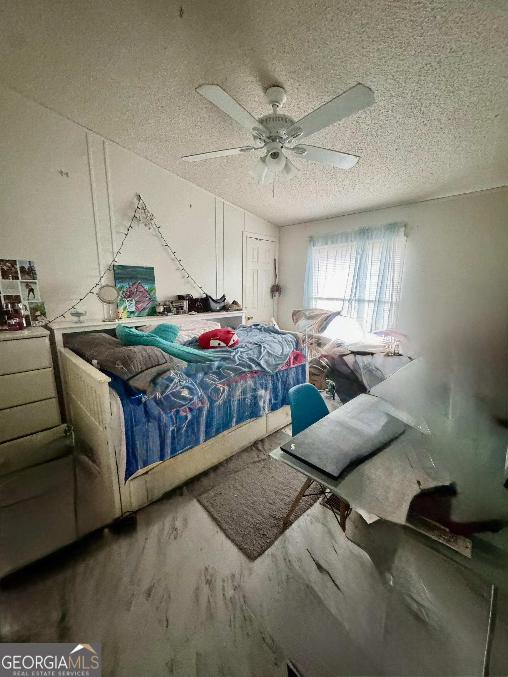 29 Settlement Road Dallas, GA 30132 - Photo 8 of 13 a bedroom with furniture and a chandelier