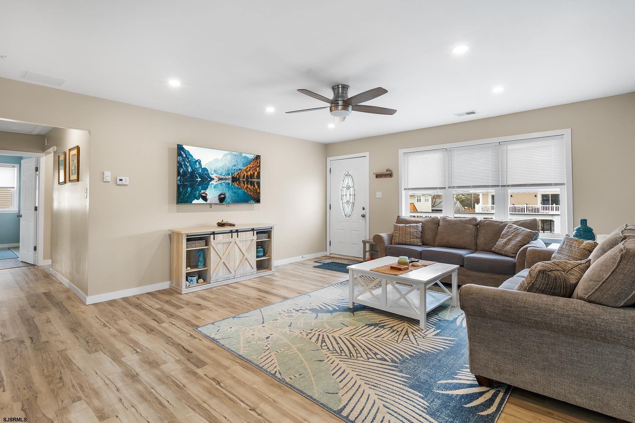 4611 Schooner Road, Unit 2 Brigantine, NJ 08203 - Photo 5 of 25 a living room with furniture and a flat screen tv