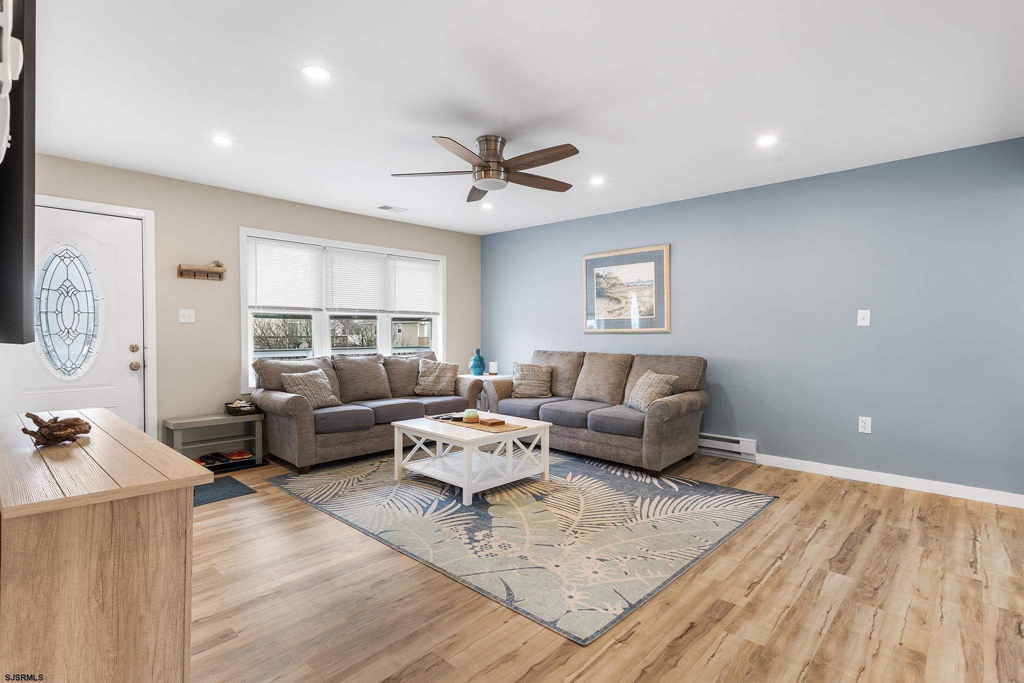 4611 Schooner Road, Unit 2 Brigantine, NJ 08203 - Photo 6 of 25 a living room with furniture and wooden floor