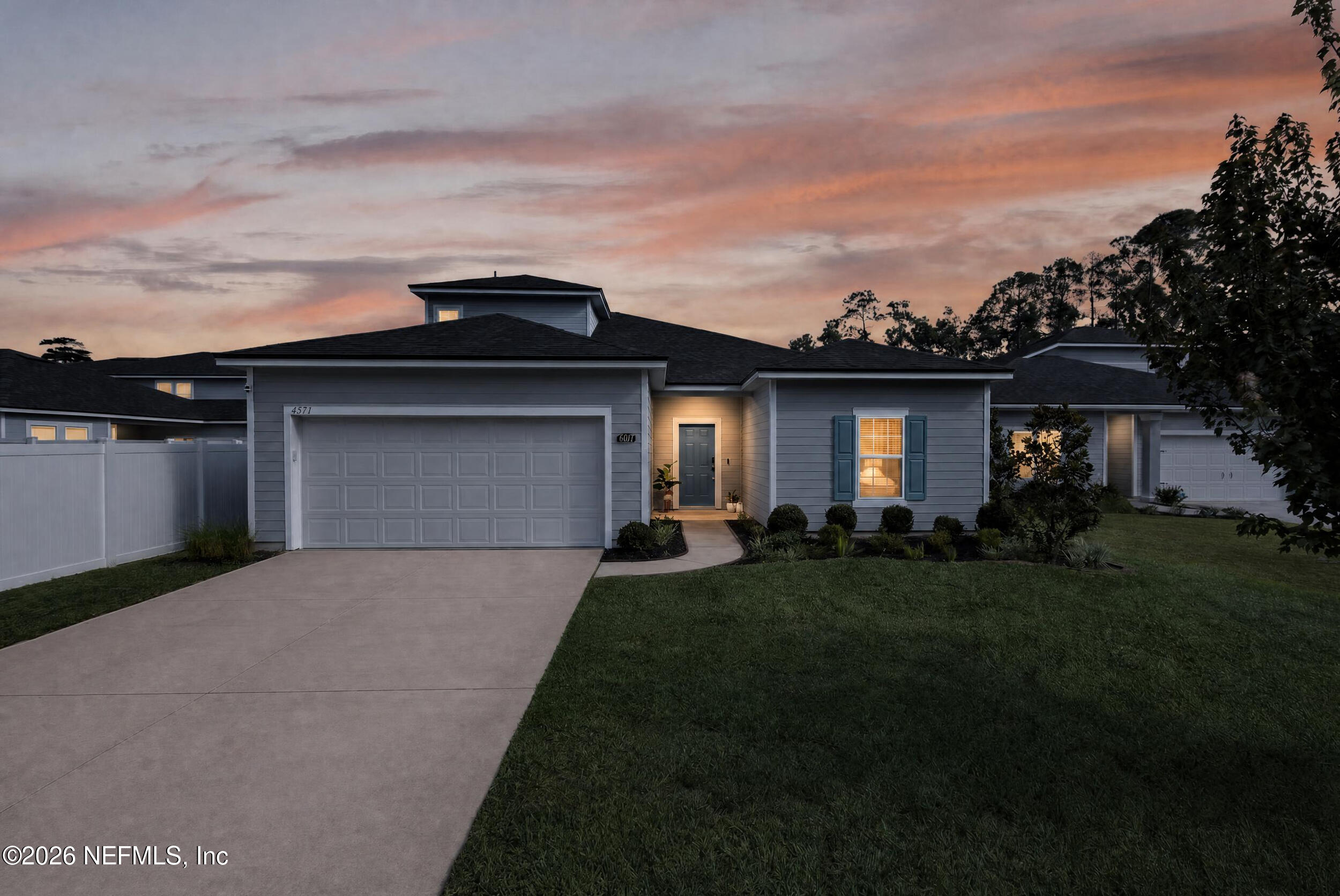 4977 Bramante Drive Jacksonville, FL 32218 - Photo 57 of 85 59_front facade sunset