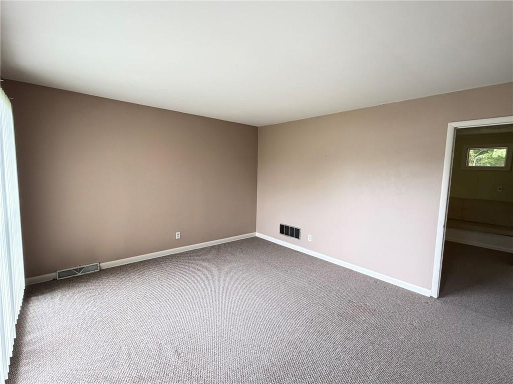 52 Lyons Drive Northwest Rome, GA 30165 - Photo 11 of 34 an empty room with a natural light