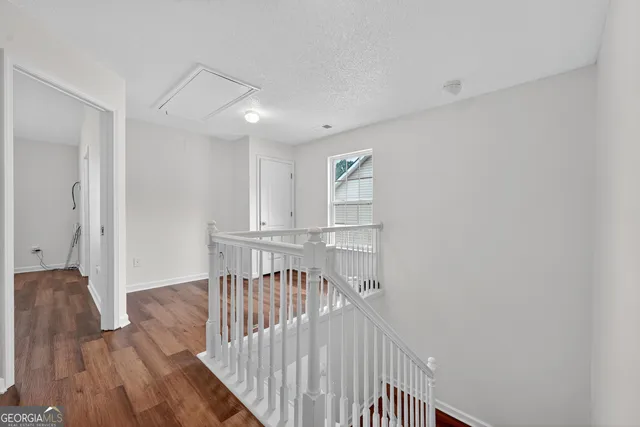 a view of entryway with wooden floor