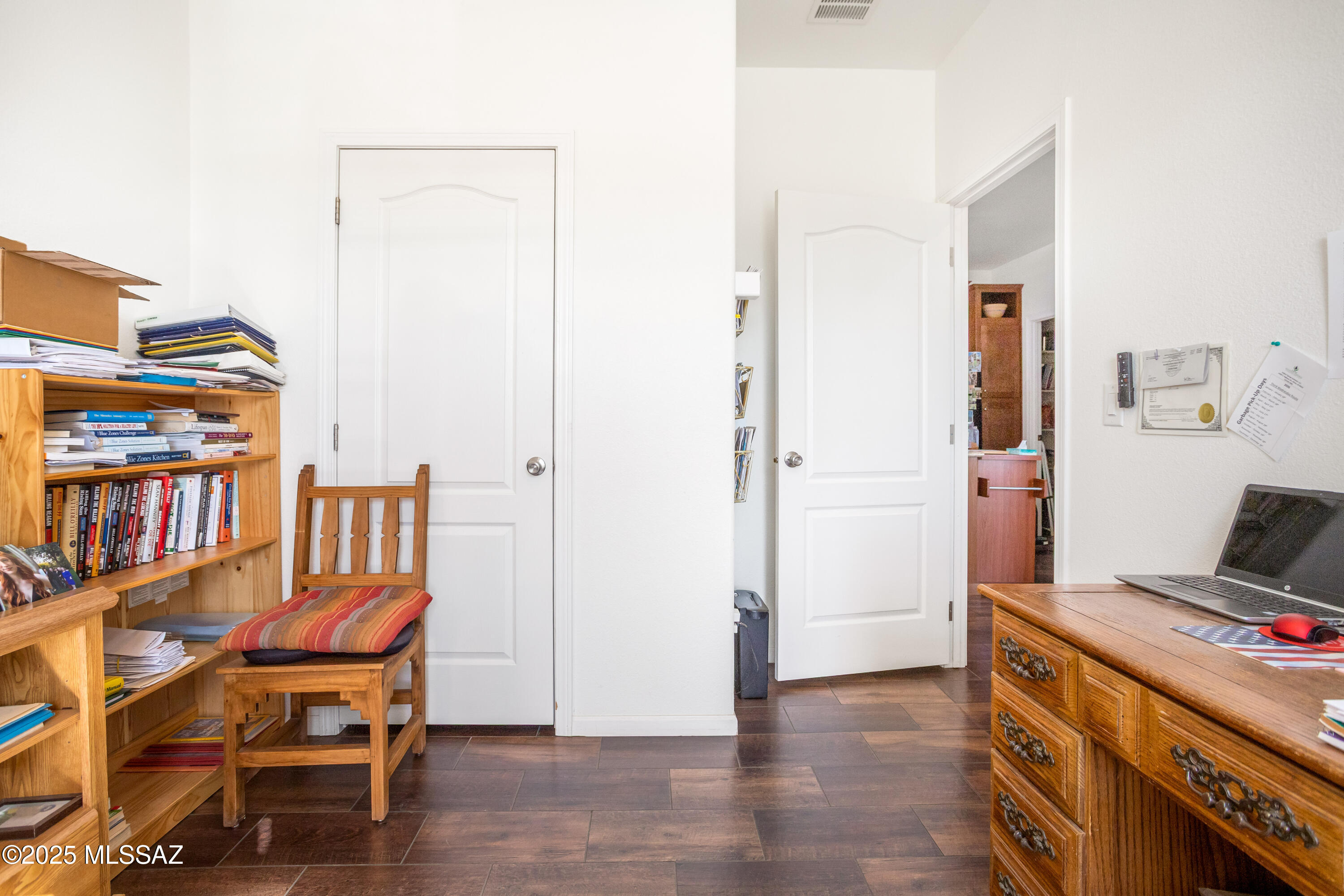 10187 North Mormon Road Elfrida, AZ 85610 - Photo 41 of 50 a view of a workspace with furniture and wooden floor