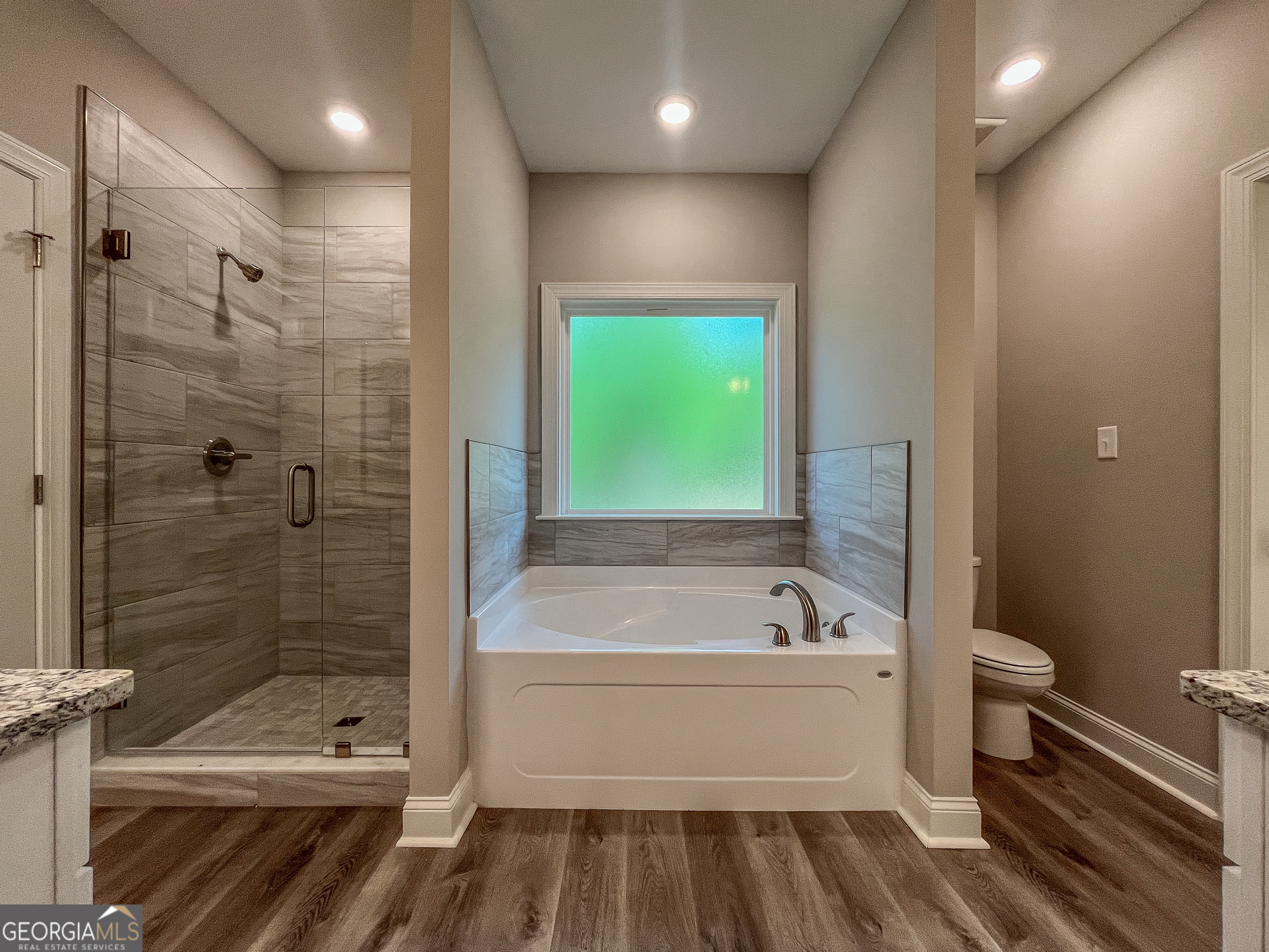 711 Flanders Lane Dublin, GA 31021 - Photo 24 of 49 a bathroom with a bathtub and a shower