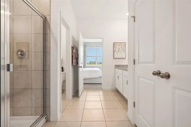 a bathroom with a shower and a sink