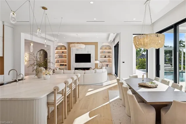 a very nice looking living room with a large window and a flat screen tv