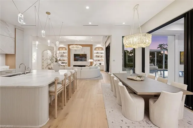 a large living room with stainless steel appliances kitchen island granite countertop furniture and a view of kitchen