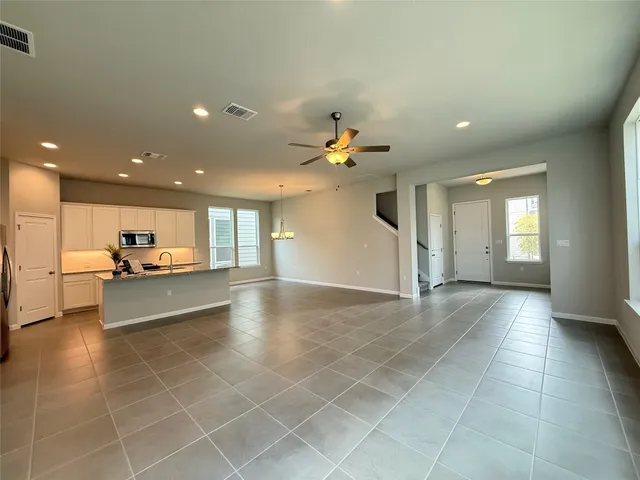 a view of a living room kitchen and a window