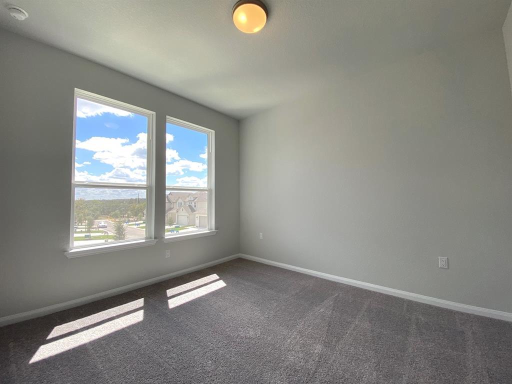 320 Creek Road, Unit 303 Dripping Springs, TX 78620 - Photo 24 of 28 an empty room with a window