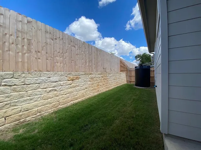 a view of a backyard of the house