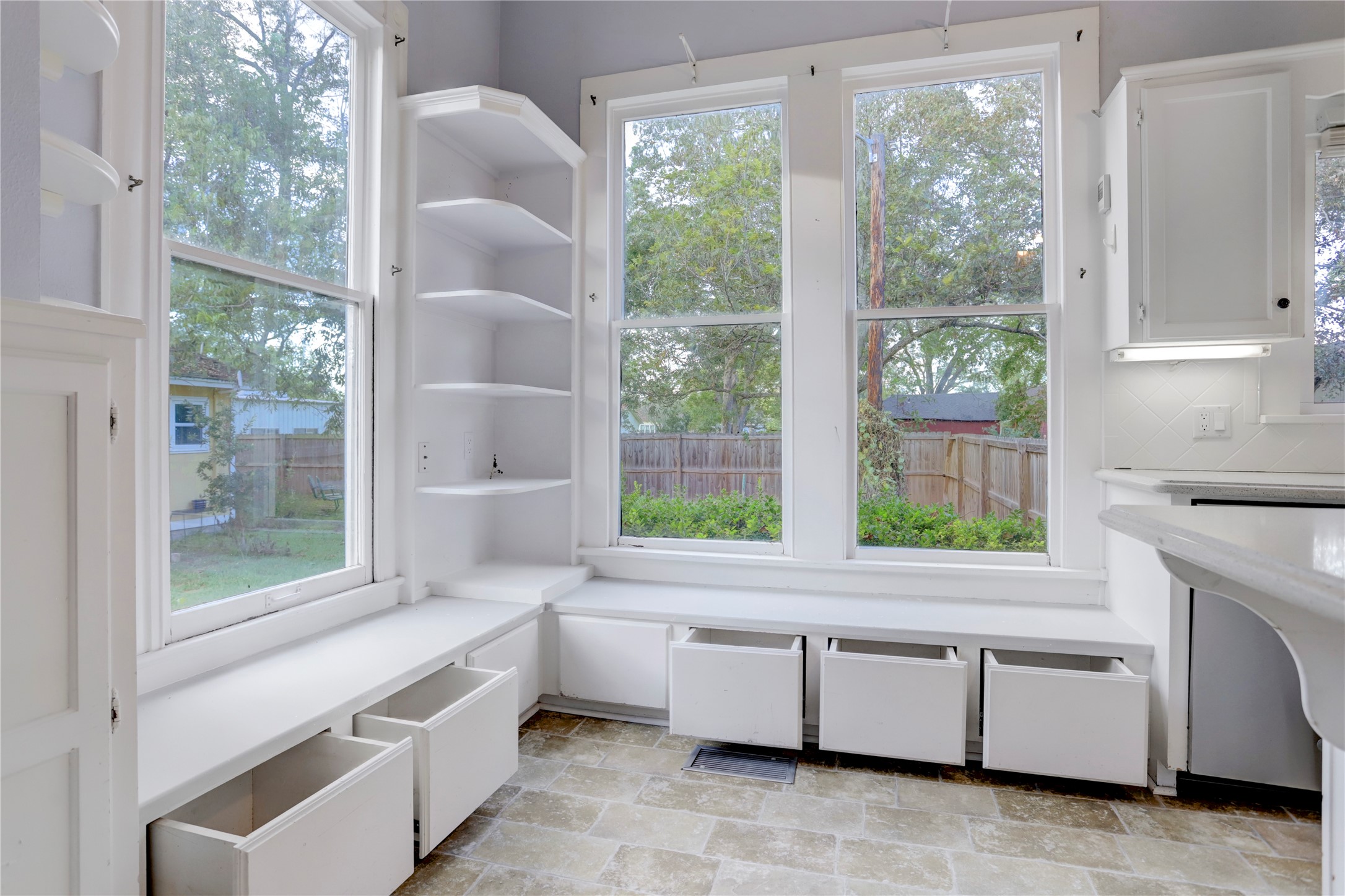 238 Bridge Street Glen Flora, TX 77443 - Photo 11 of 34 a kitchen with a white cabinets and a large window