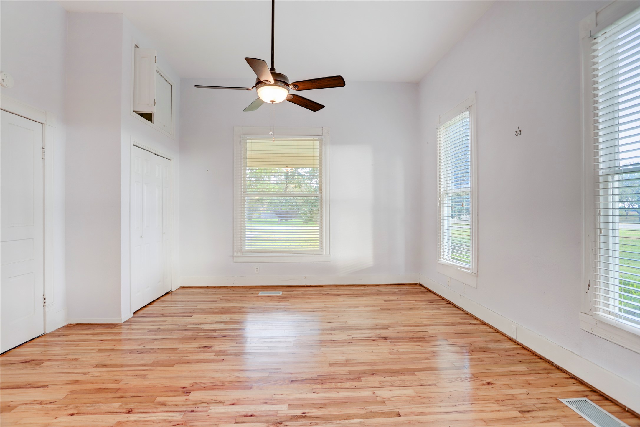238 Bridge Street Glen Flora, TX 77443 - Photo 14 of 34 a view of empty room with window and wooden floor