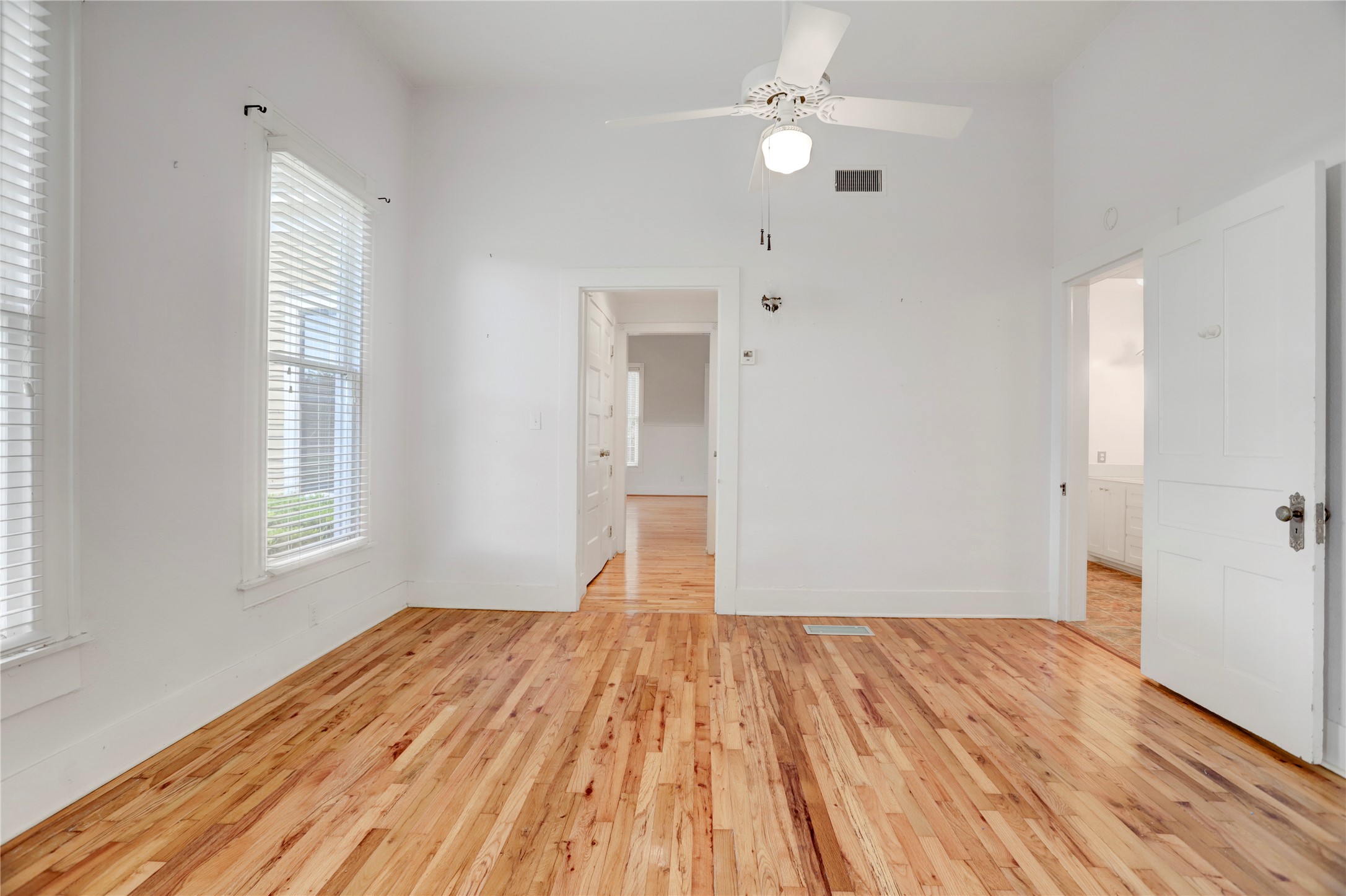 238 Bridge Street Glen Flora, TX 77443 - Photo 15 of 34 an empty room with wooden floor and windows
