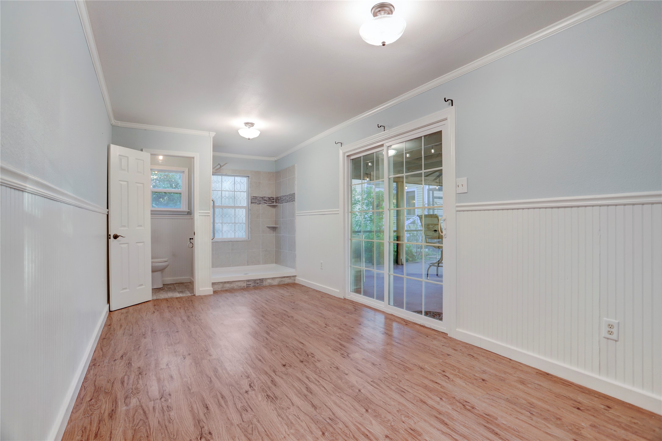 238 Bridge Street Glen Flora, TX 77443 - Photo 26 of 34 wooden floor in an empty room with a window