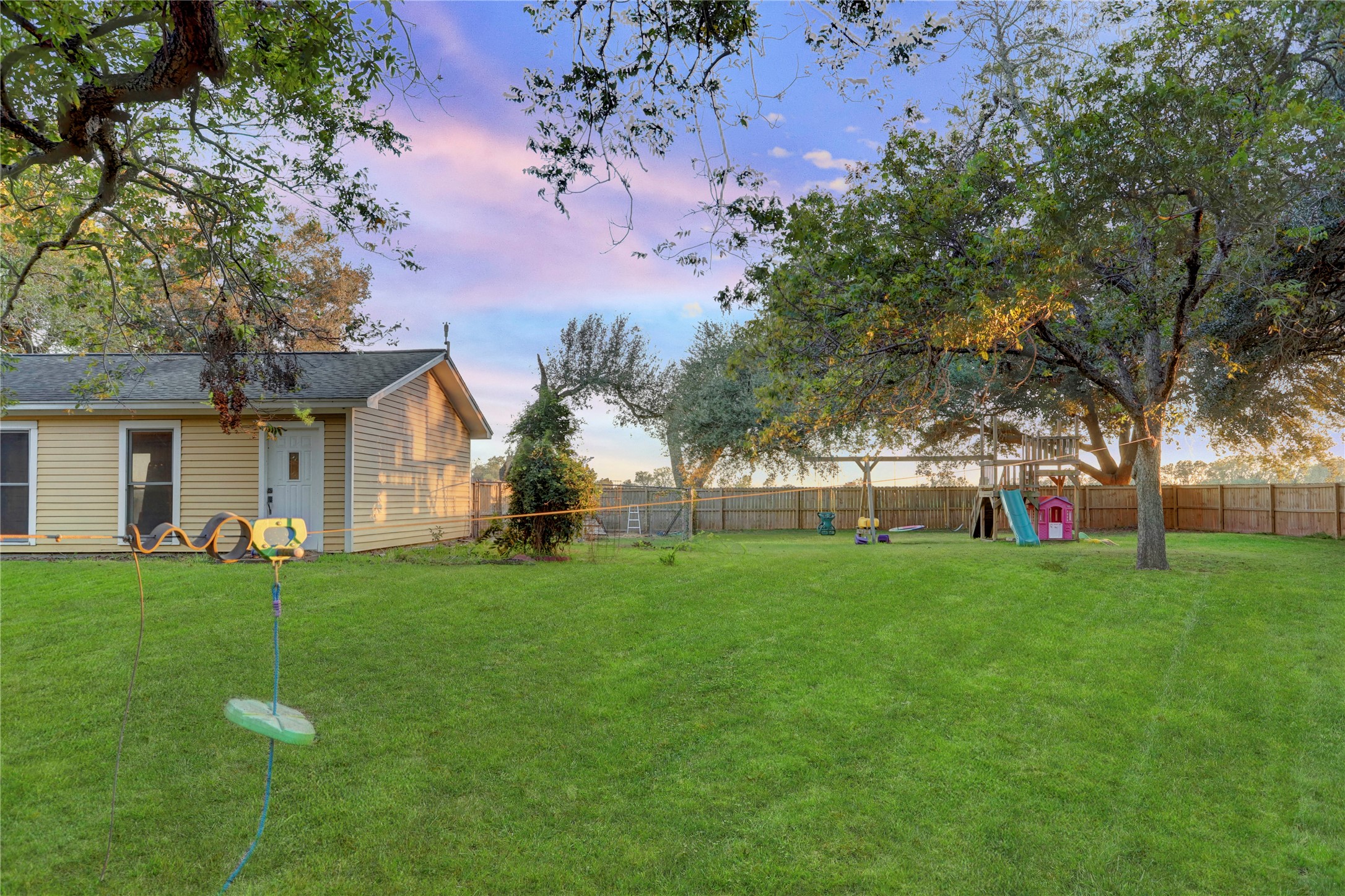 238 Bridge Street Glen Flora, TX 77443 - Photo 31 of 34 a front view of house with yard and trees