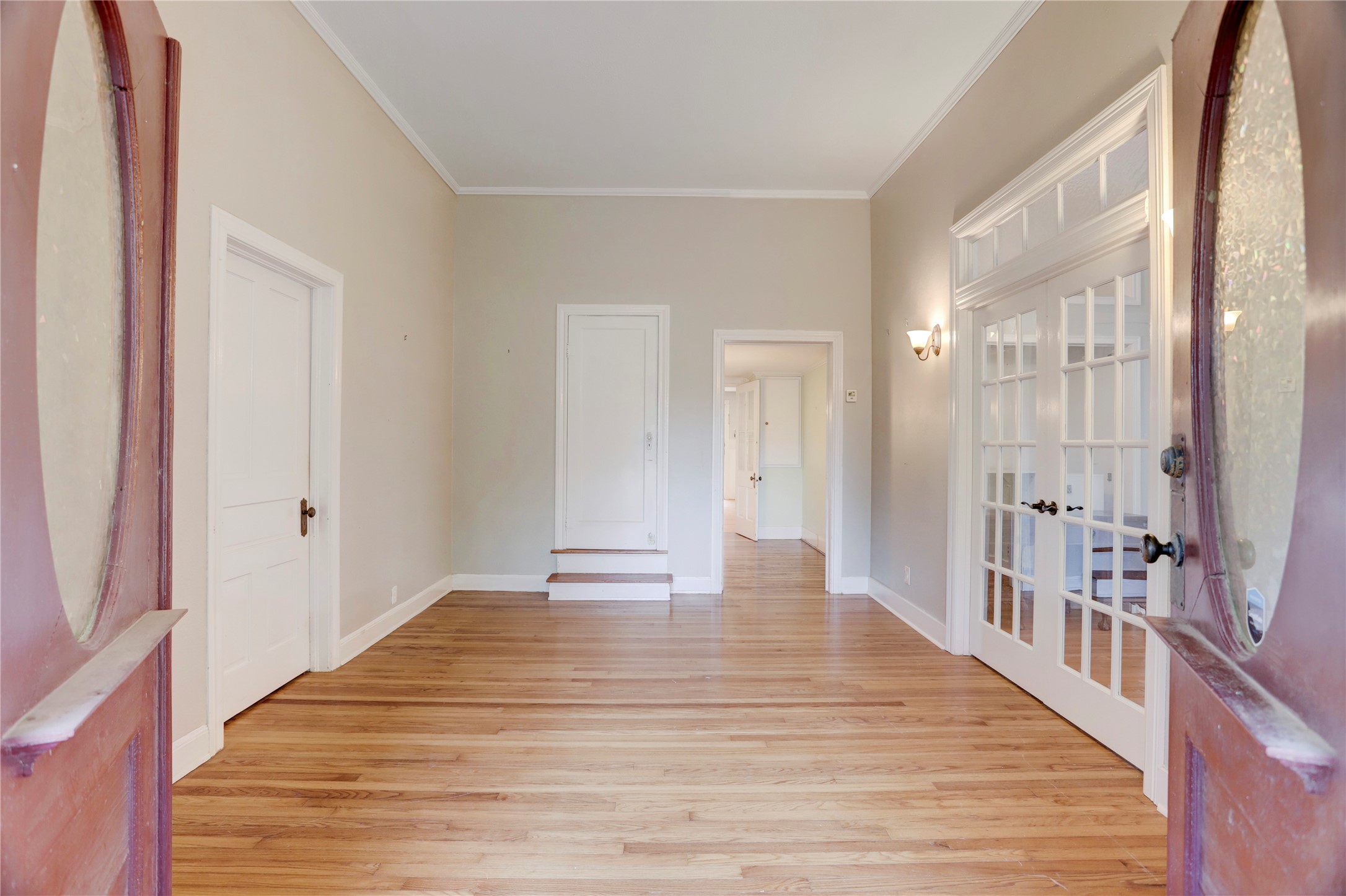 238 Bridge Street Glen Flora, TX 77443 - Photo 5 of 34 a view of a hallway with wooden floor and a bathroom