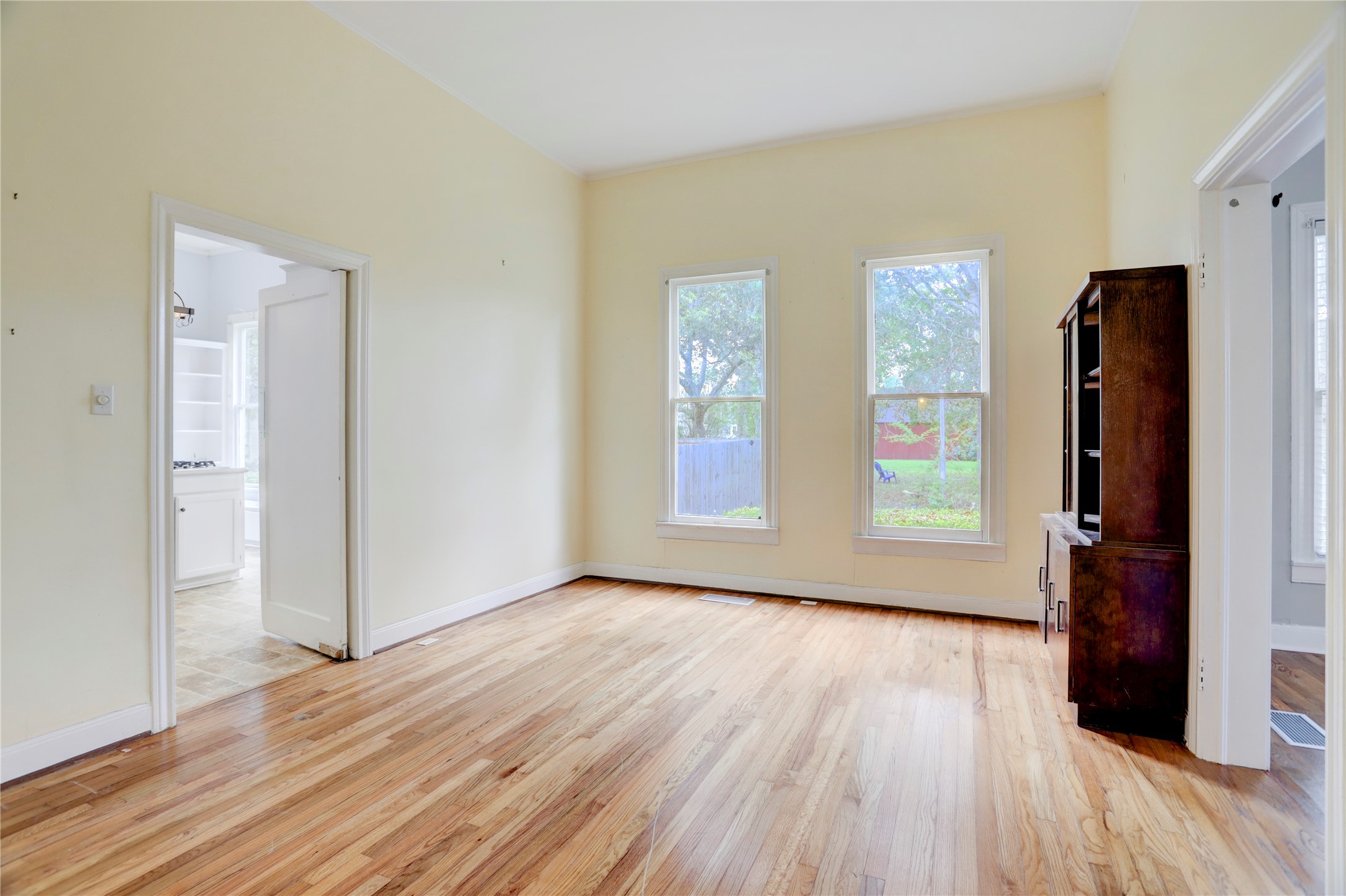 238 Bridge Street Glen Flora, TX 77443 - Photo 7 of 34 an empty room with wooden floor and windows
