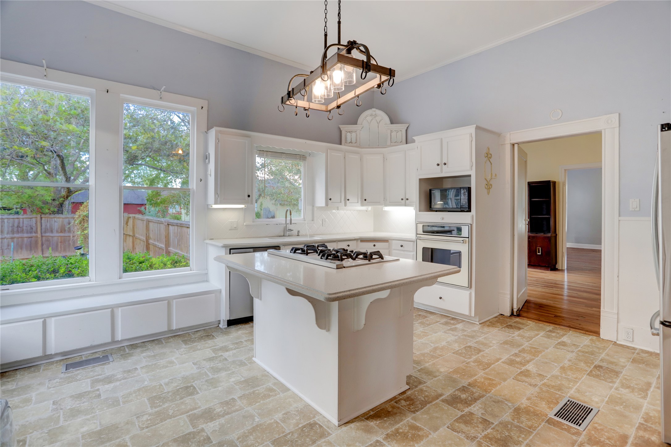 238 Bridge Street Glen Flora, TX 77443 - Photo 8 of 34 a kitchen with kitchen island granite countertop a stove and a refrigerator