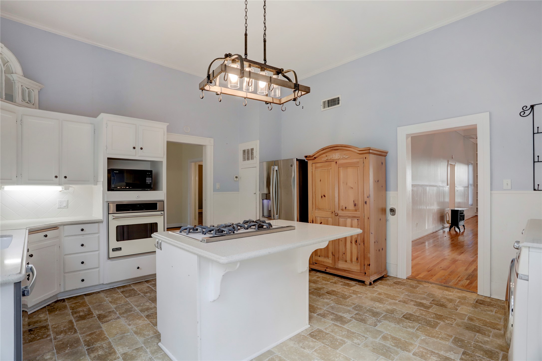 238 Bridge Street Glen Flora, TX 77443 - Photo 9 of 34 a kitchen with stainless steel appliances kitchen island granite countertop a stove and a refrigerator