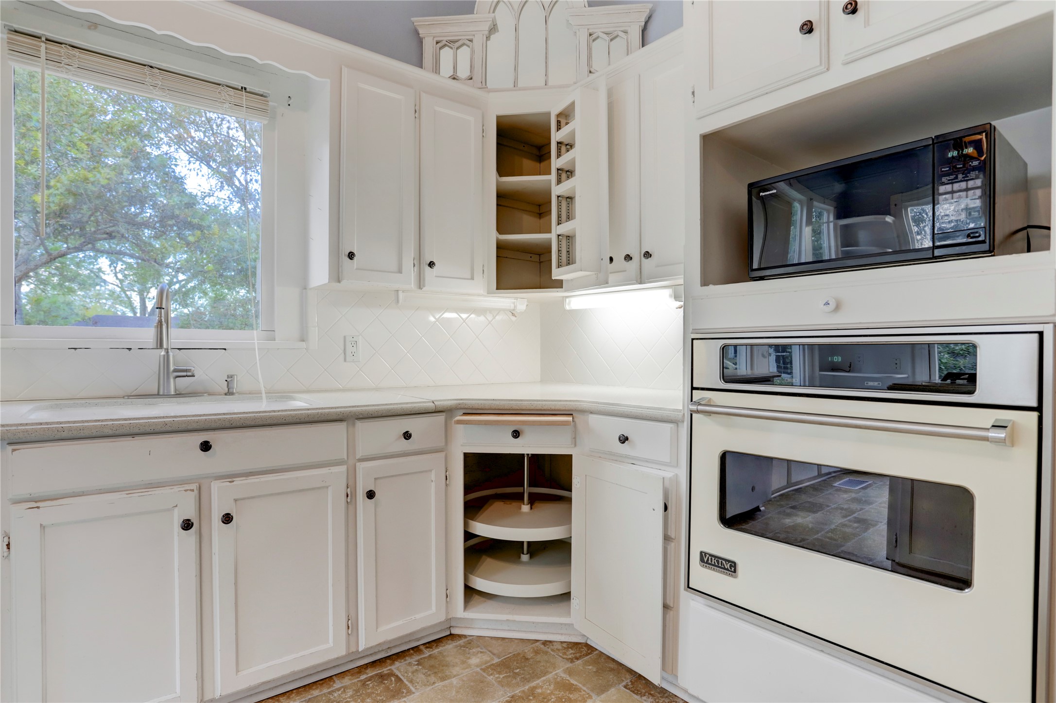 238 Bridge Street Glen Flora, TX 77443 - Photo 10 of 34 a kitchen with stainless steel appliances white cabinets and a window