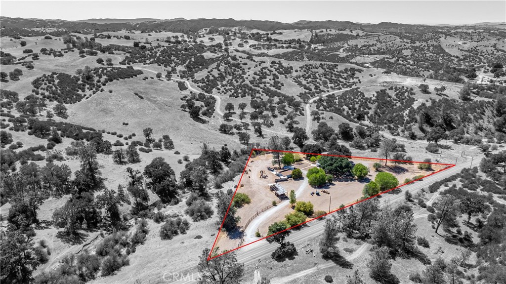 an aerial view of house with yard