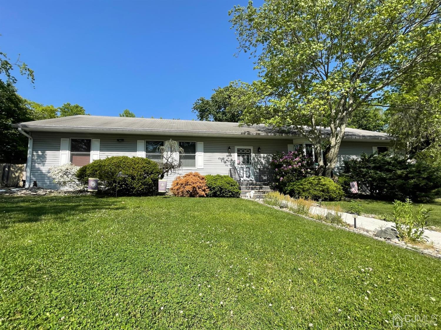 252 Amboy Road Old Bridge, NJ 07747 - Photo 1 of 1 a front view of a house with garden