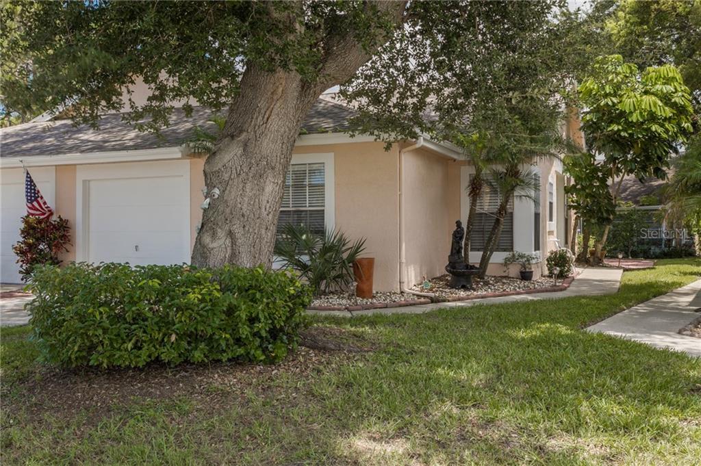 4216 Boston Circle New Port Richey, FL 34653 - Photo 1 of 1 a front view of house with yard and green space