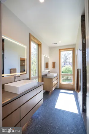a room with a bed and a large window