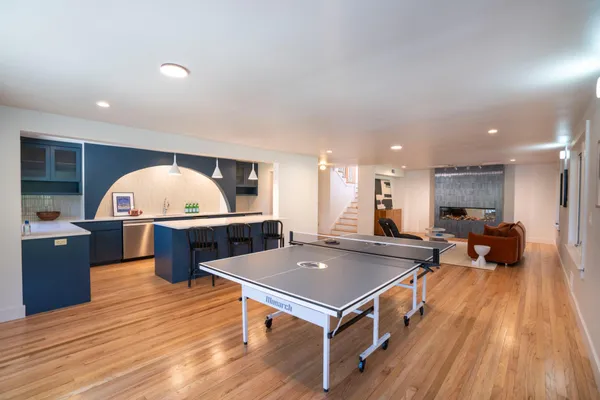 a view of a living room and kitchen tables