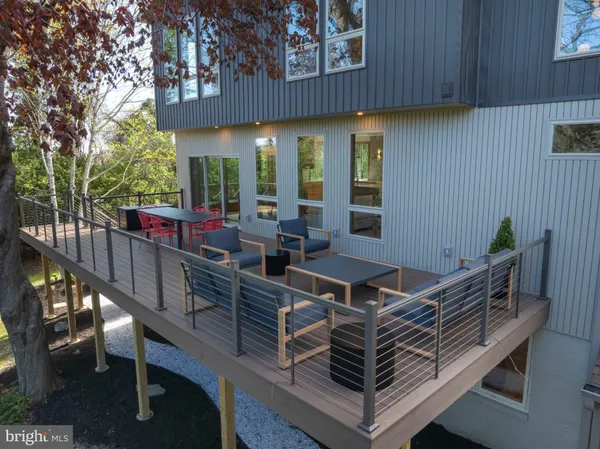 a view of an chairs and tables in the balcony