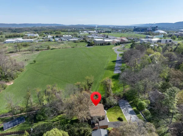an aerial view of a houses with outdoor space