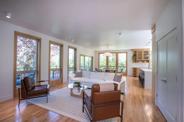 a living room with furniture and a large window