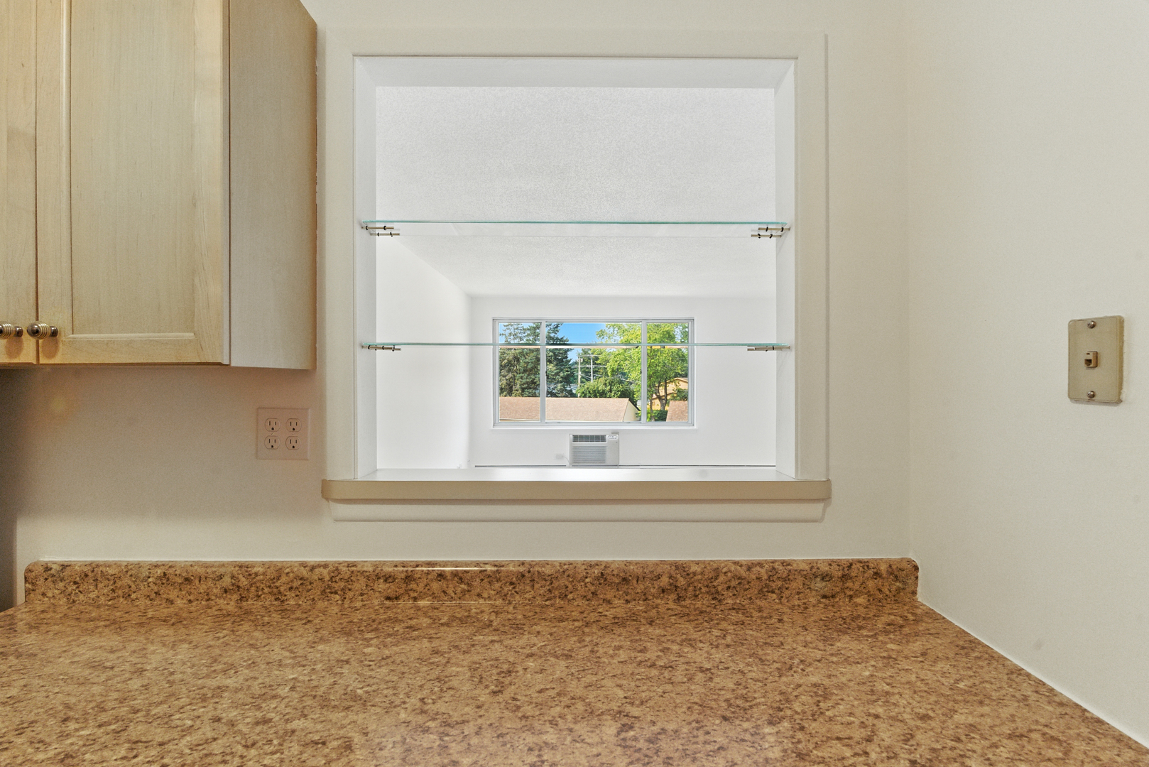 1207 South Old Wilke Road, Unit 303 Rolling Meadows, IL 60005 - Photo 12 of 34 a view of a small space with wooden floor and a window