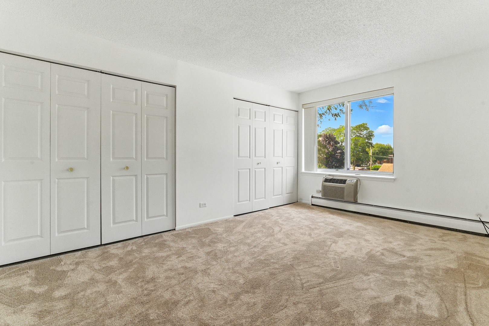 1207 South Old Wilke Road, Unit 303 Rolling Meadows, IL 60005 - Photo 15 of 34 a view of an empty room with a window
