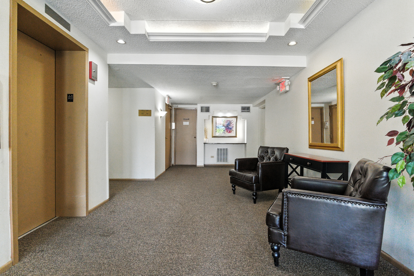1207 South Old Wilke Road, Unit 303 Rolling Meadows, IL 60005 - Photo 4 of 34 a living room with furniture and a window