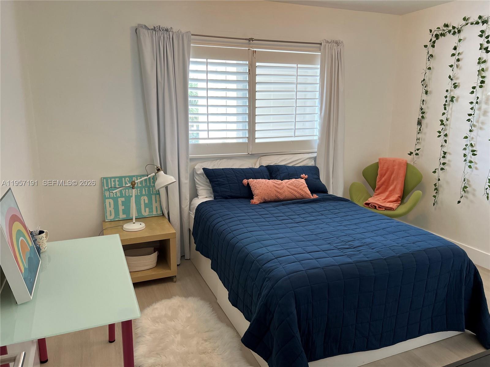 240 Galen Drive, Unit 206 Key Biscayne, FL 33149 - Photo 7 of 9 a bedroom with a bed and window