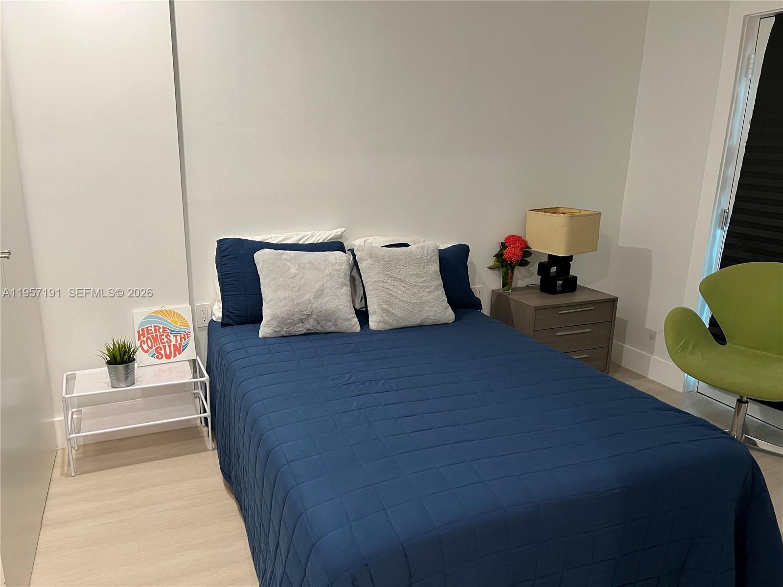 240 Galen Drive, Unit 206 Key Biscayne, FL 33149 - Photo 8 of 9 a bedroom with a bed and a couch