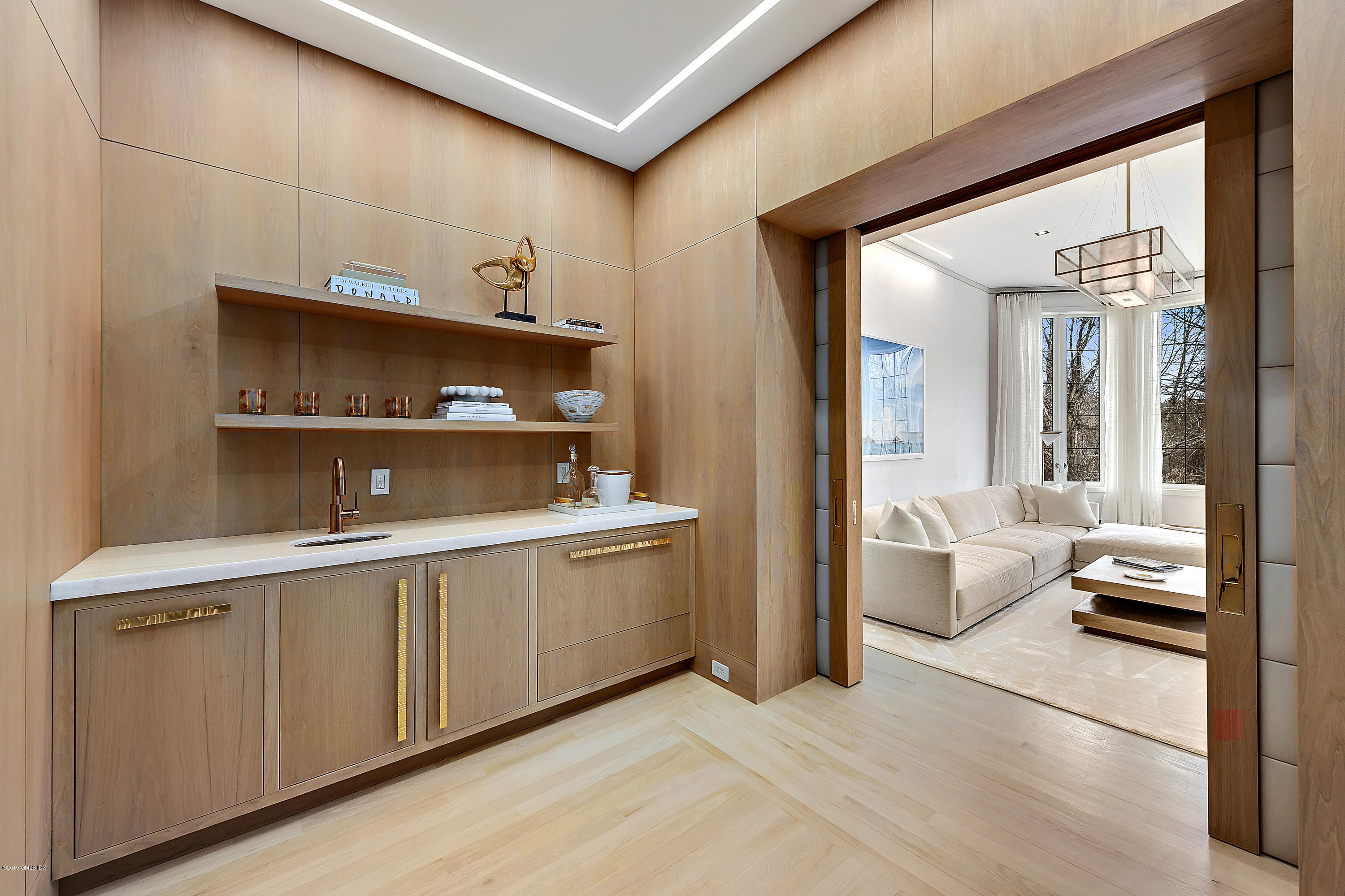 19 Lower Cross Road Greenwich, CT 06831 - Photo 14 of 36 a living room with stainless steel appliances kitchen island granite countertop furniture and a view of living room