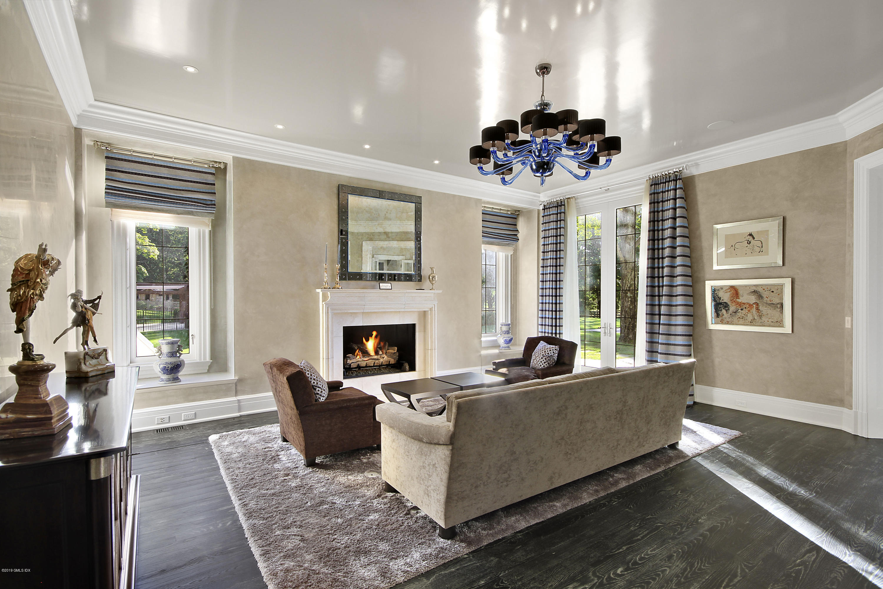 19 Lower Cross Road Greenwich, CT 06831 - Photo 17 of 36 a living room with furniture and a fireplace