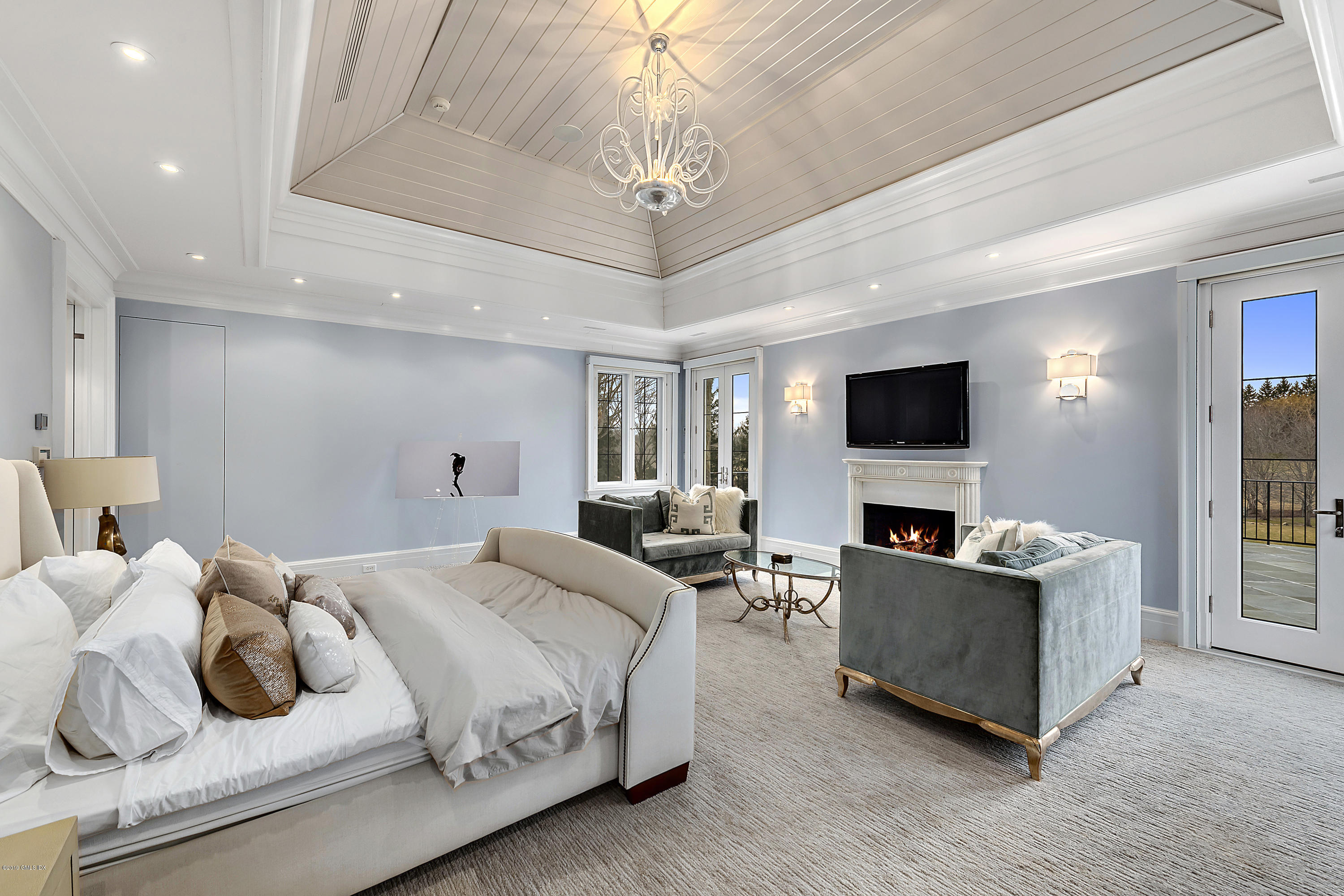 19 Lower Cross Road Greenwich, CT 06831 - Photo 19 of 36 a bedroom with bed and flat screen tv