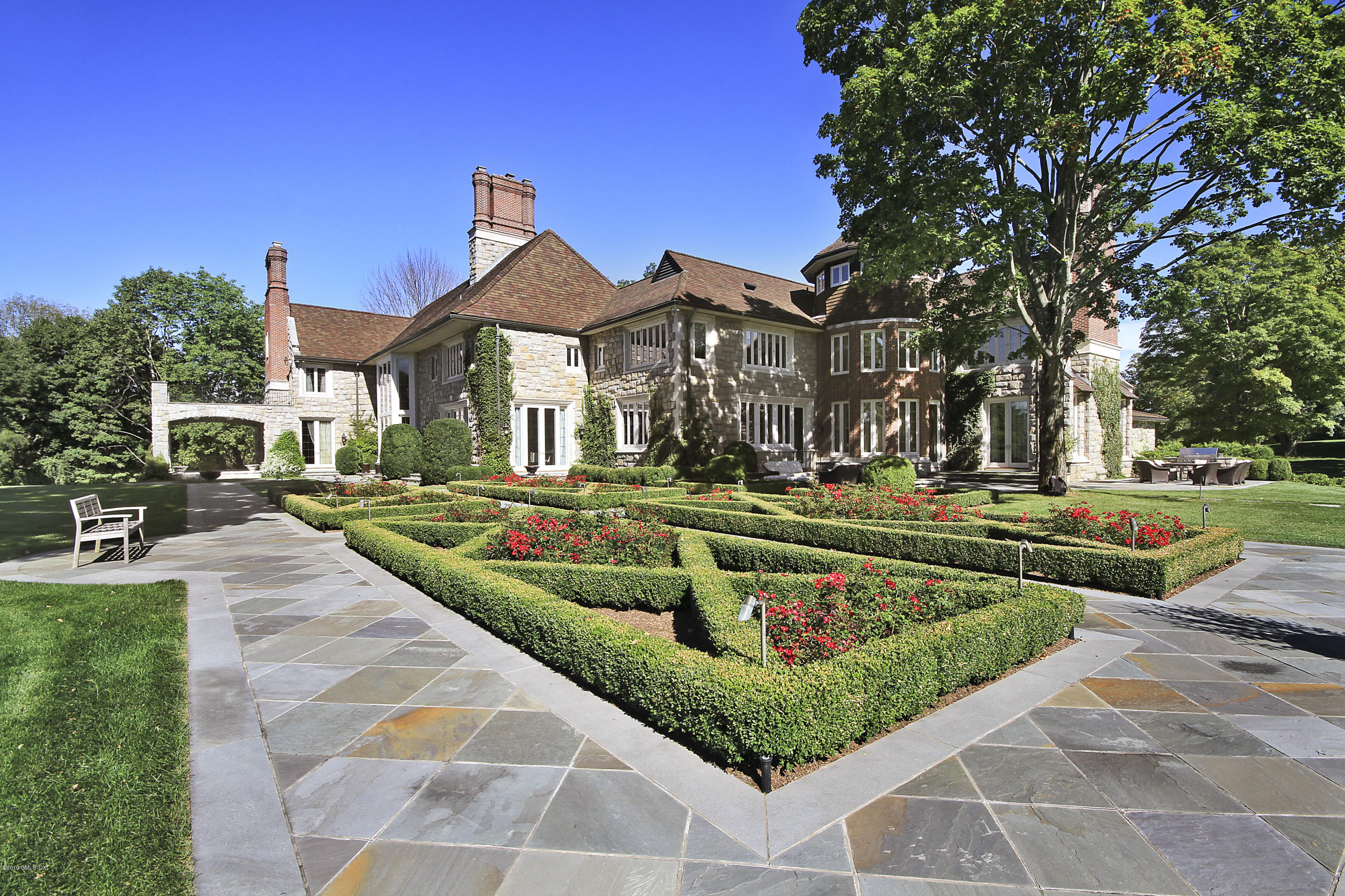 19 Lower Cross Road Greenwich, CT 06831 - Photo 31 of 36 a front view of a house with a yard