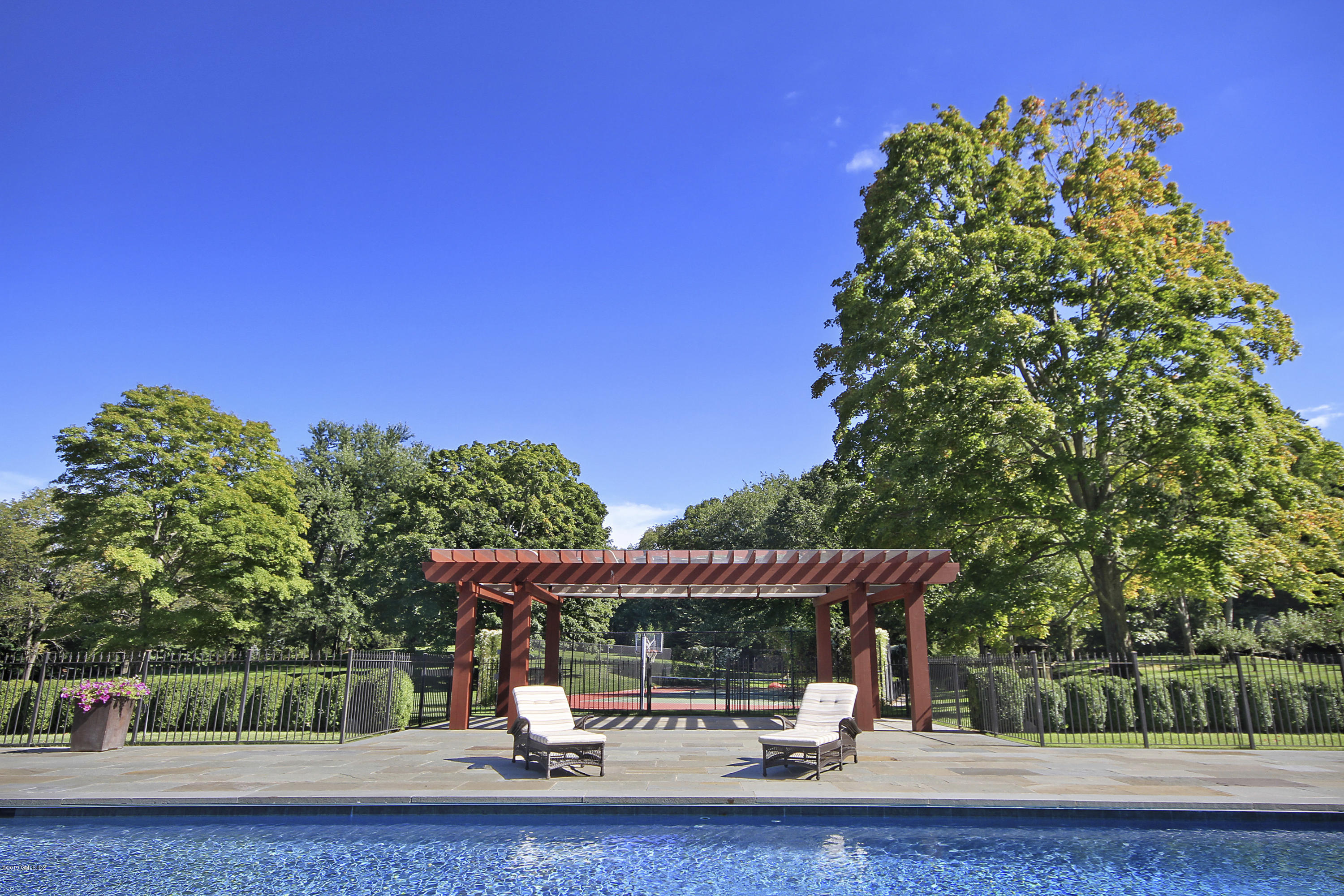 19 Lower Cross Road Greenwich, CT 06831 - Photo 33 of 36 a view of a park with iron fence