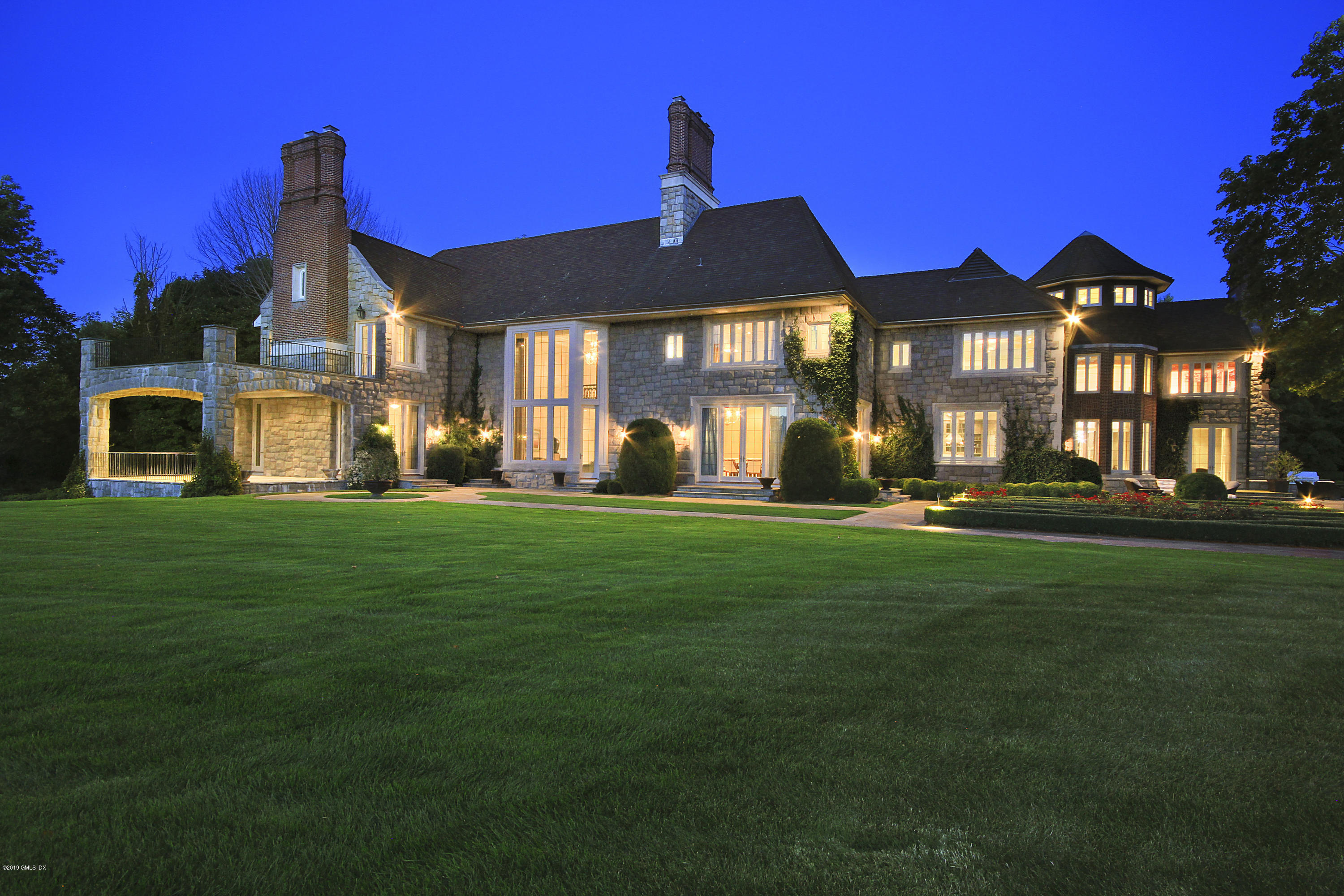 19 Lower Cross Road Greenwich, CT 06831 - Photo 34 of 36 a front view of a house with a yard