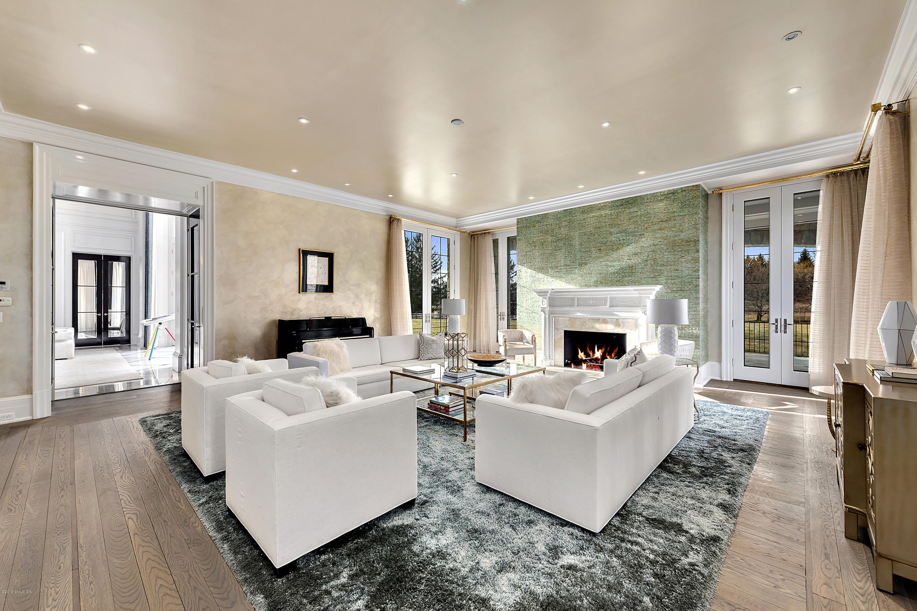 19 Lower Cross Road Greenwich, CT 06831 - Photo 4 of 36 a living room with furniture and a fireplace