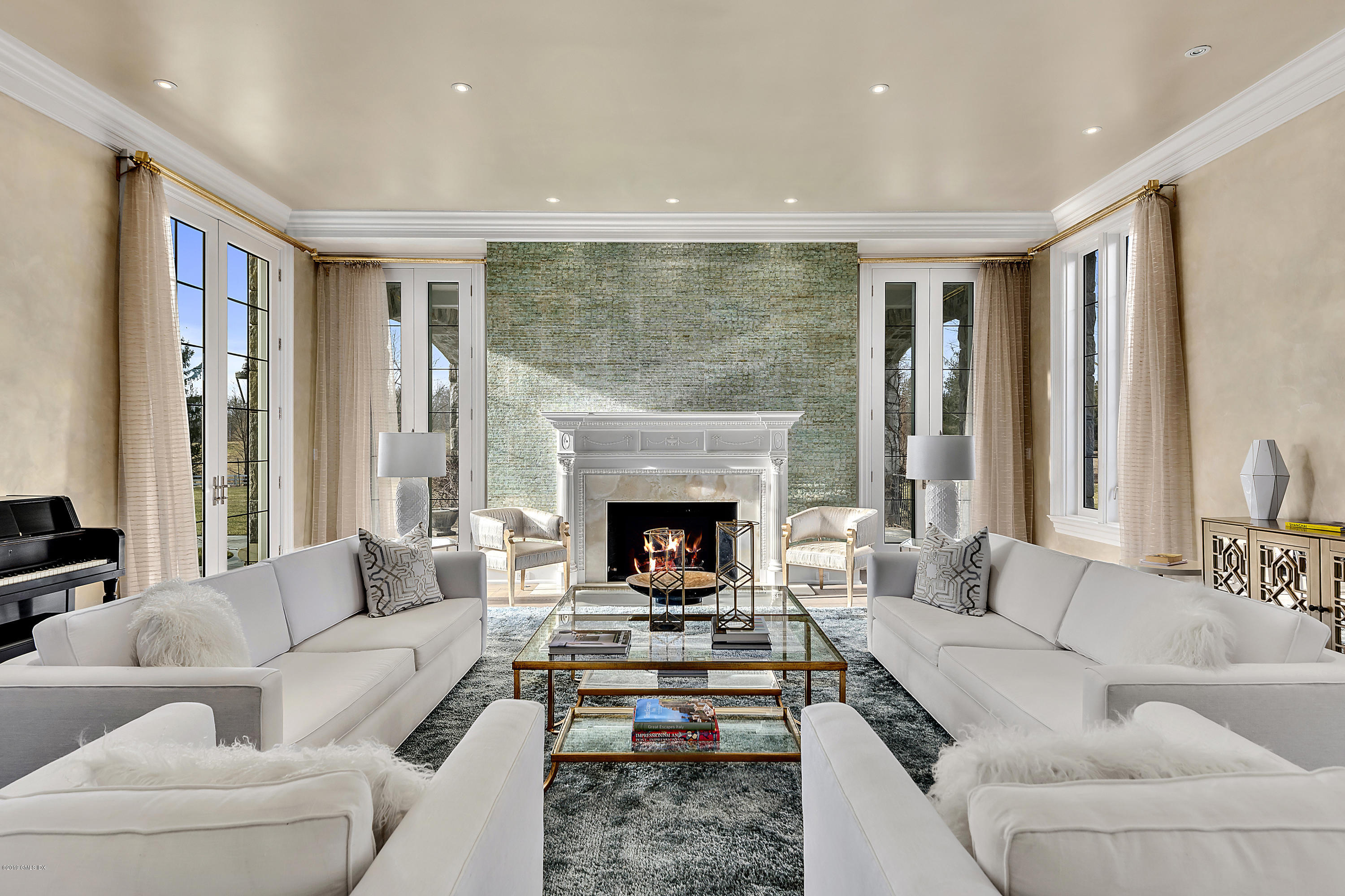 19 Lower Cross Road Greenwich, CT 06831 - Photo 5 of 36 a living room with furniture fireplace and a large window